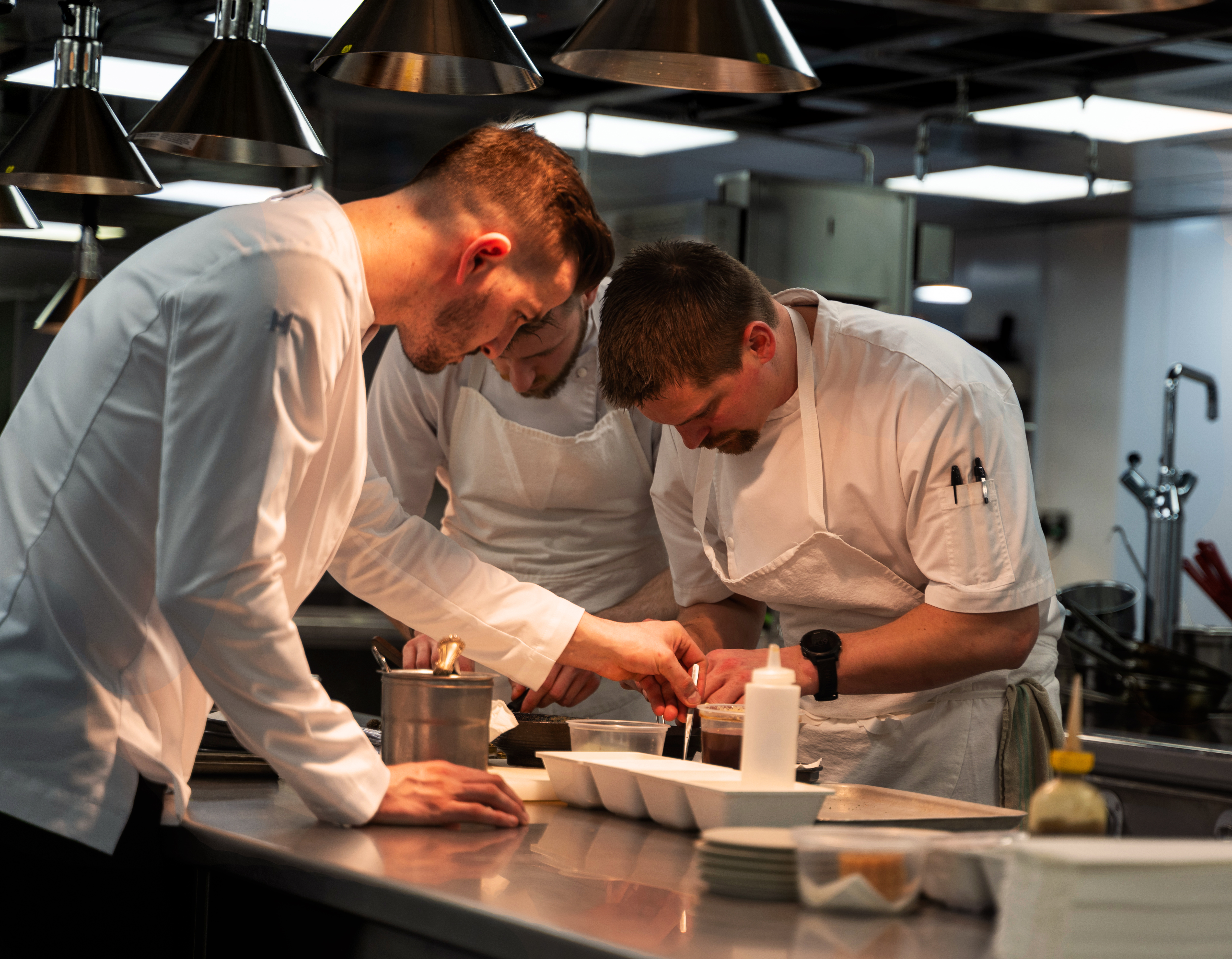 Chefs working in the restaurant kitchen at Whatley Manor, Malmesbury