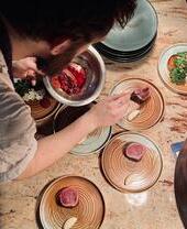 A chef plating up food in Brighton's highly rated Kindling Restaurant