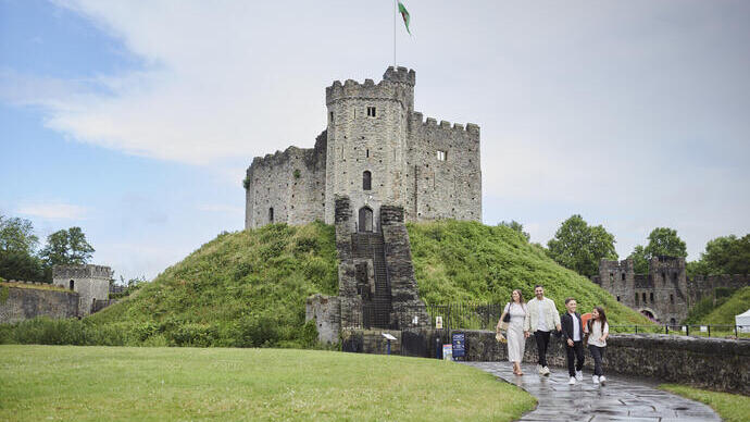 Family walking in front of a castle