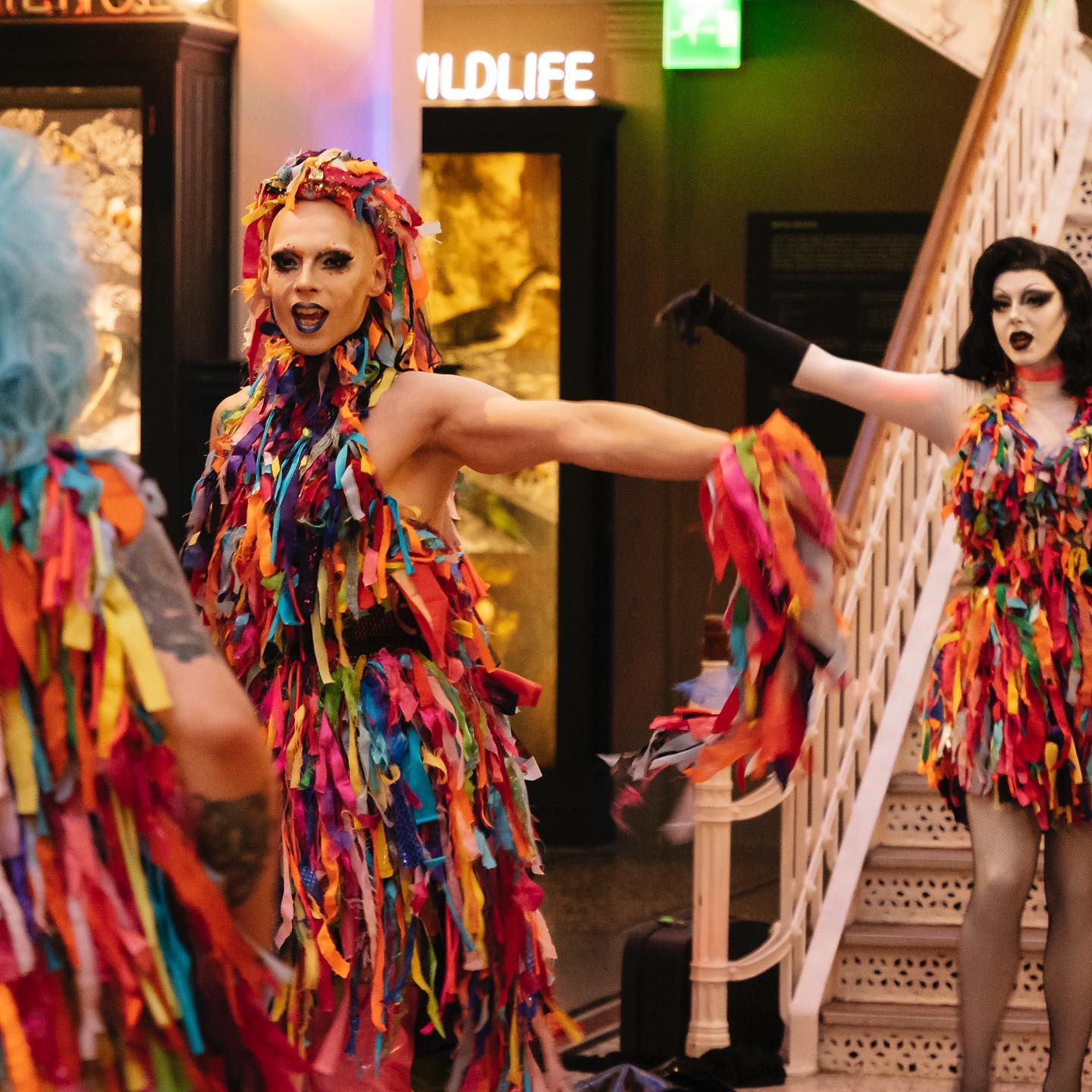 People dressed up in colourful outfits at the Manchester Museum