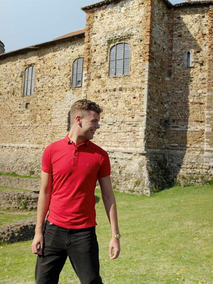 Two men standing in front of a castle