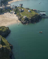 Coastline of a town with beach and castle