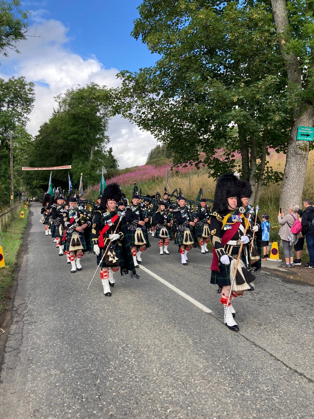 A group fo bagpipers at Lonach Highland Gathering, Scotland