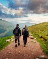 Two men hiking on Ben Nevis in the summertime