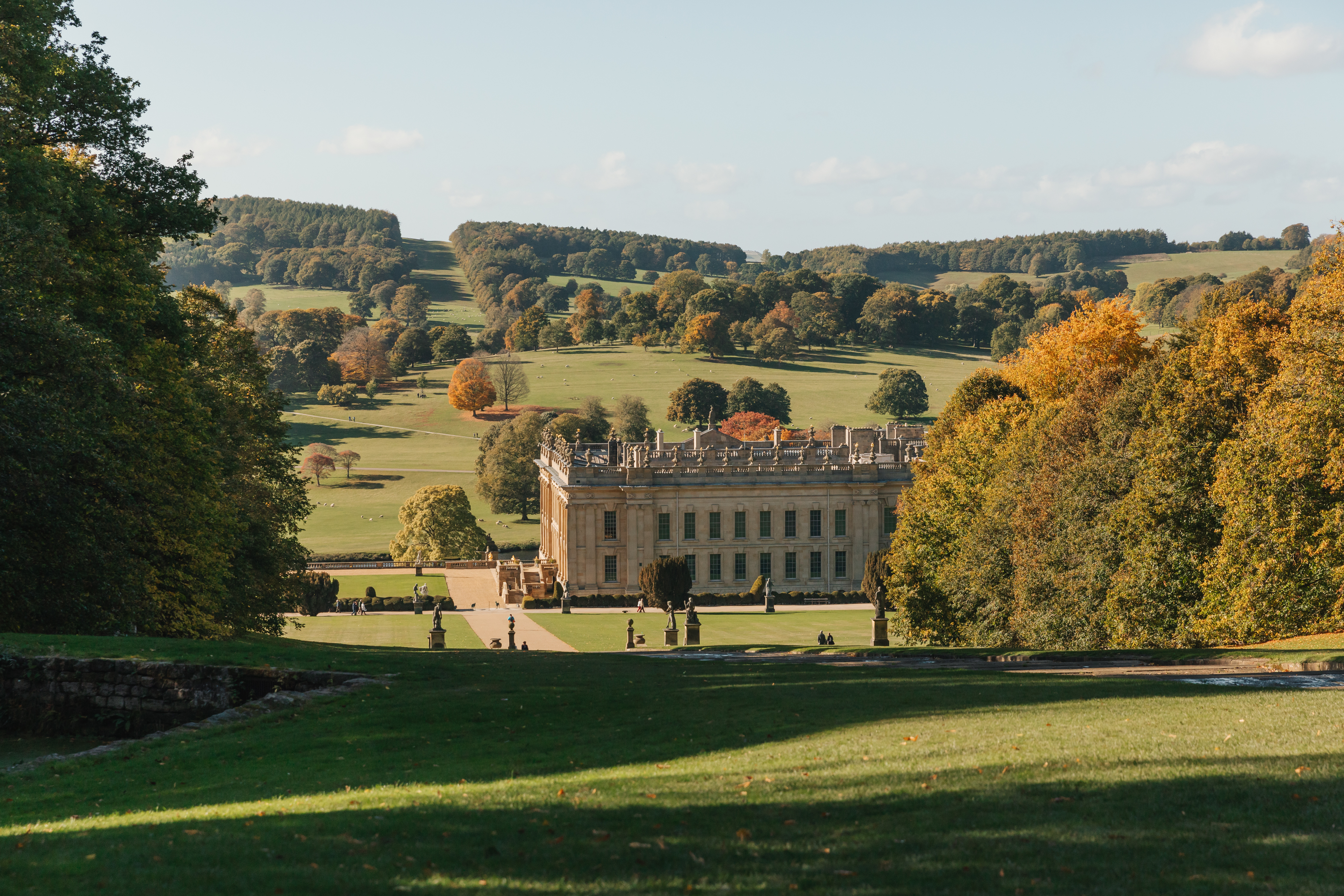 Exterior view of country house and gardens in autumn