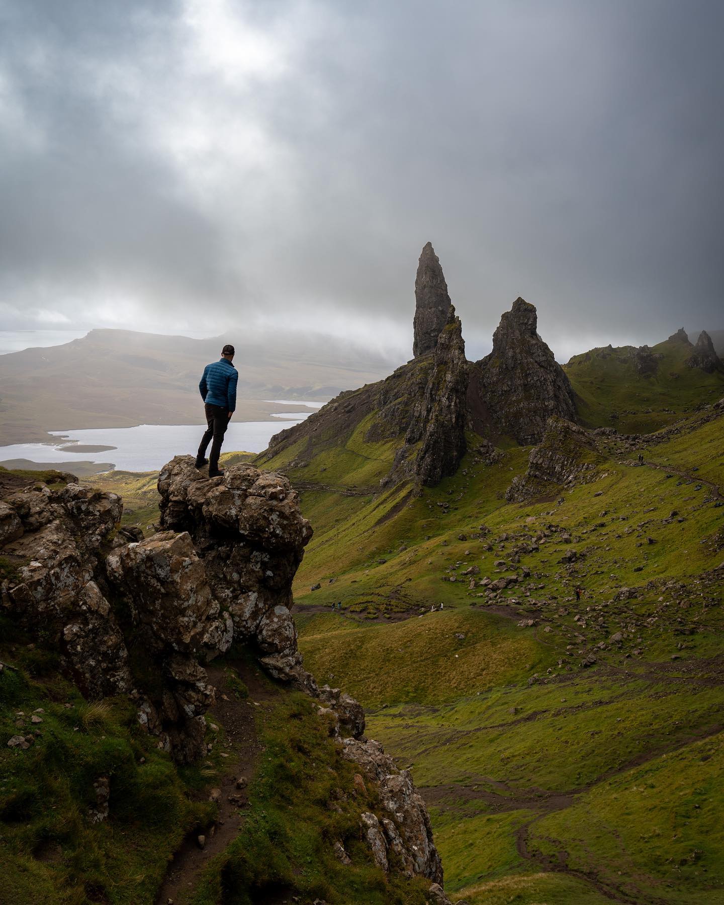Man on a rock on The Old Man of Storr