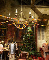 Christmas tree in a common room with casual student clothes on dummies