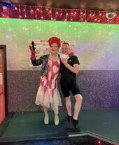 Two people outside Planet Bar in Edinburgh, Scotland