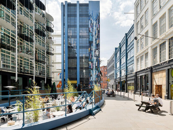 People sitting down at Digbeth Estate, Birmingham