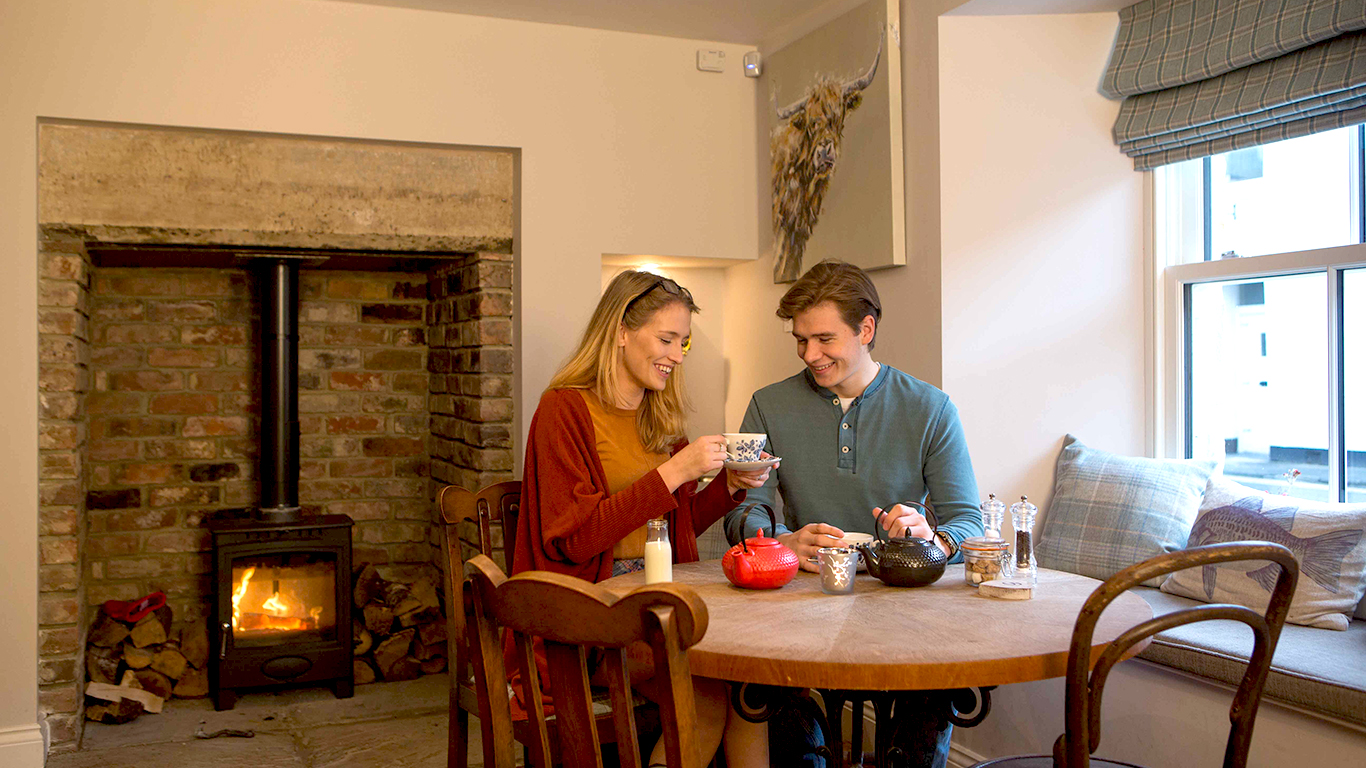 A man and a woman drinking tea at Bertram’s
