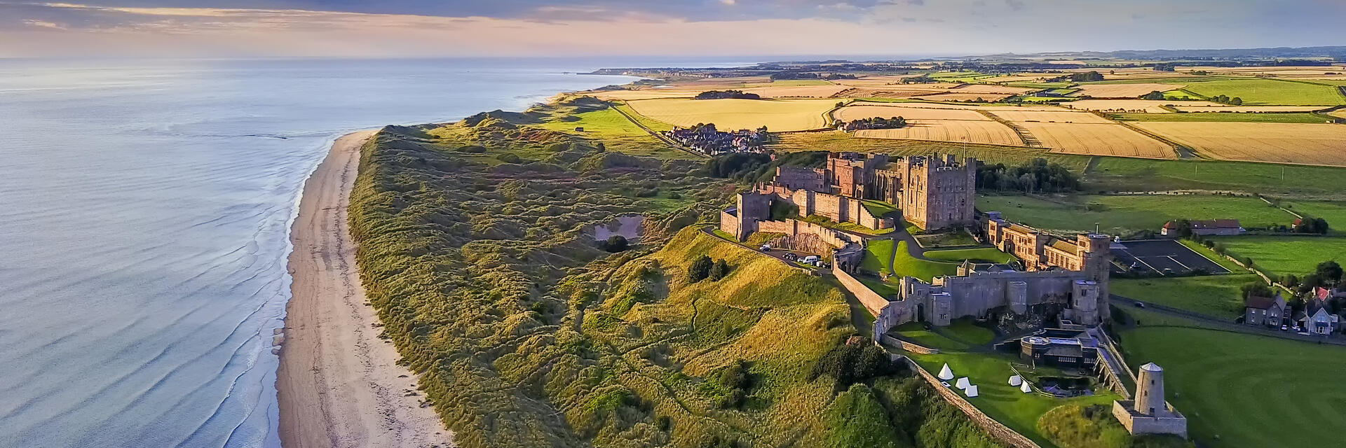 Aerial view of a large castle on the coast