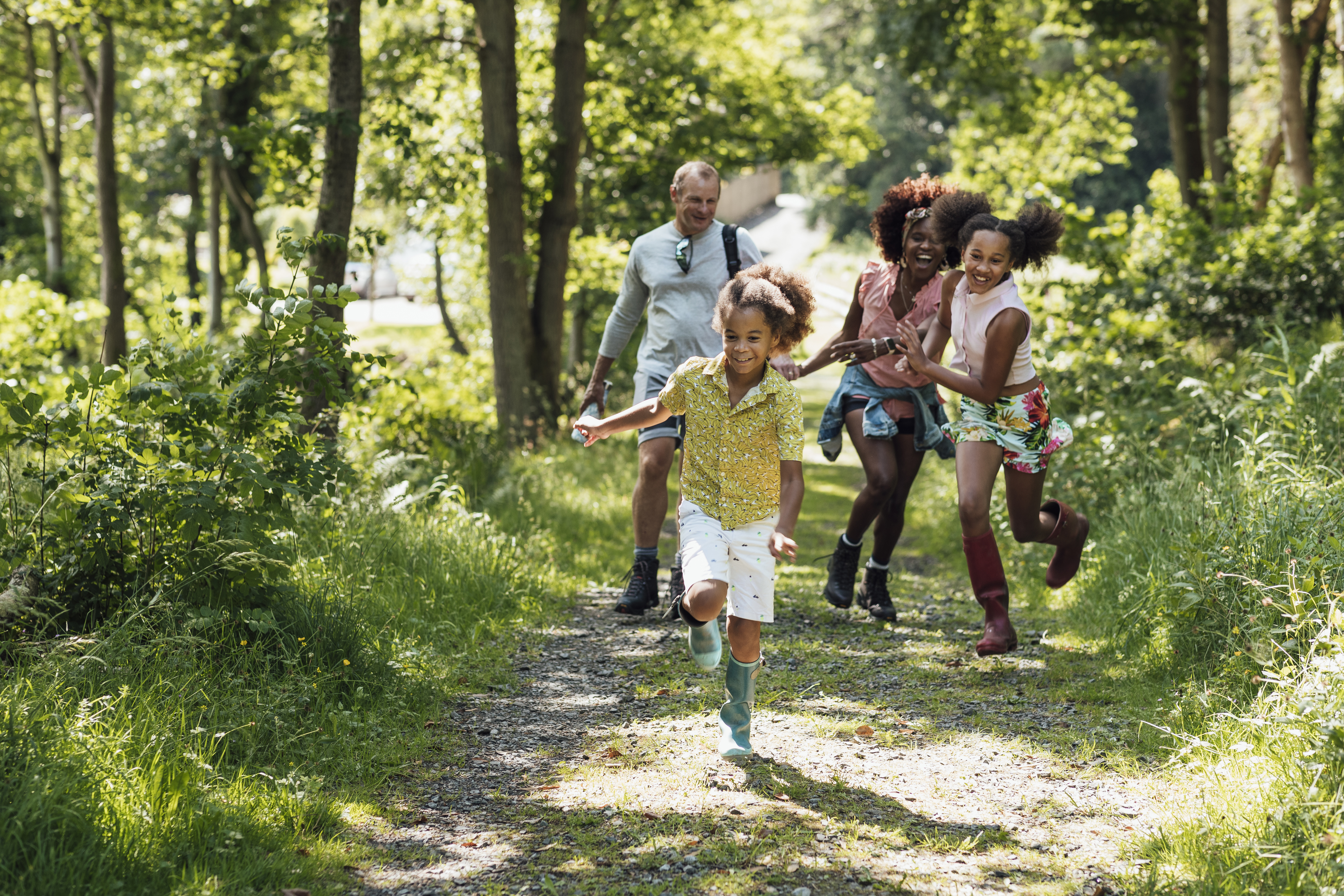 A shot of a family walking in the countryside.