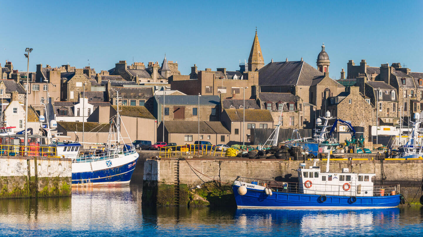 Boats in a harbour in a British seaside town.