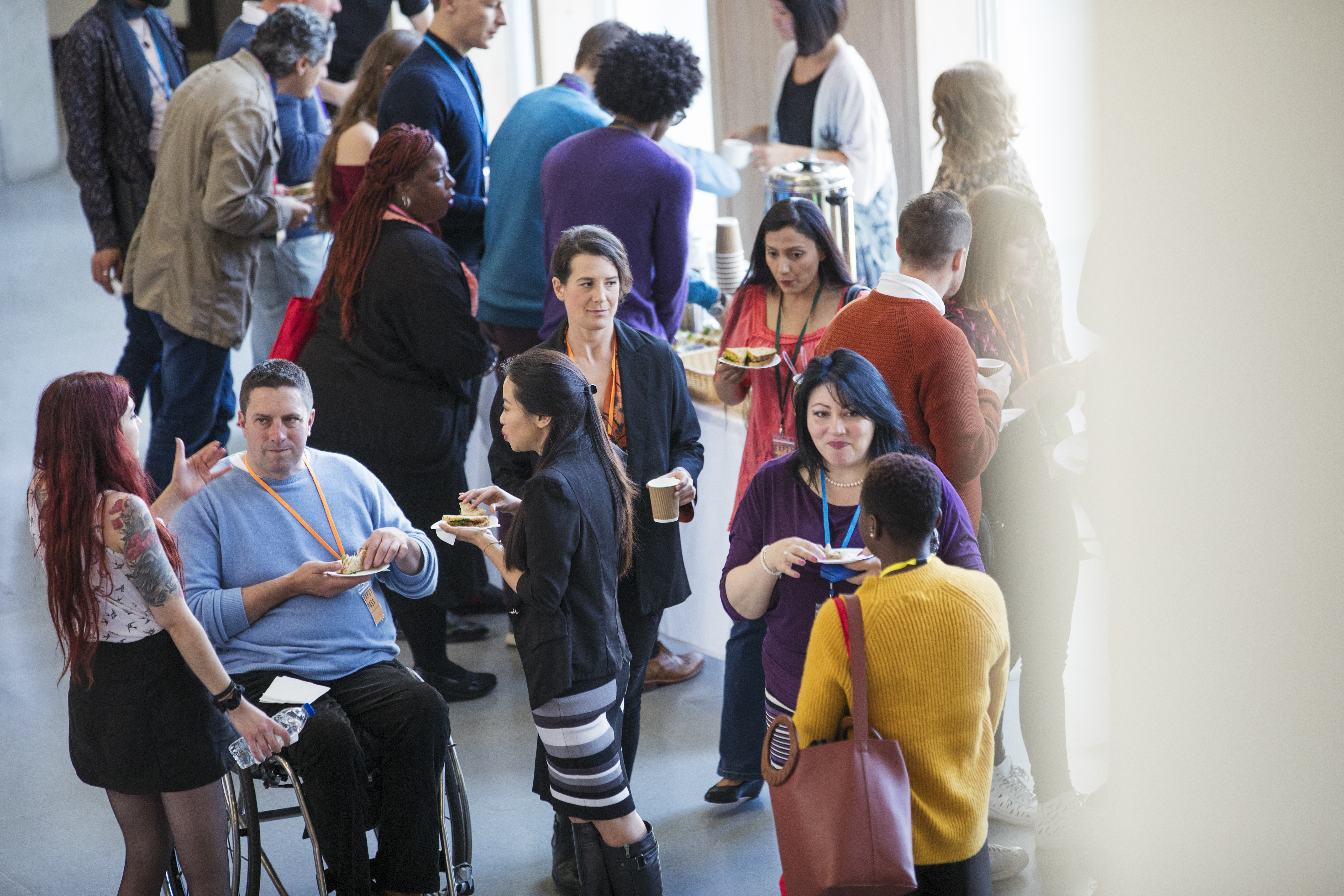 Group of people talking during a conference break