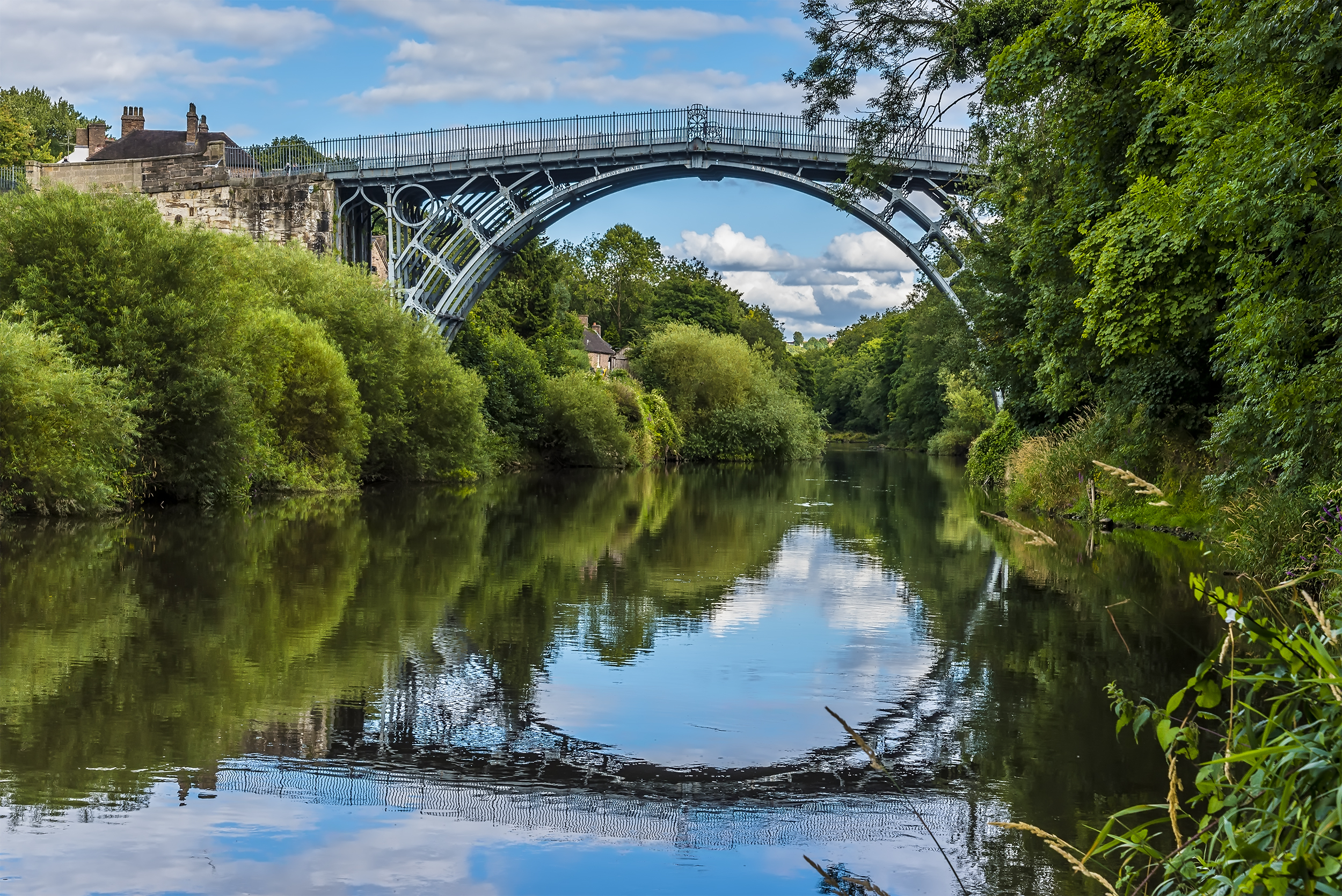 A lovely iron arched bridge over a pretty river