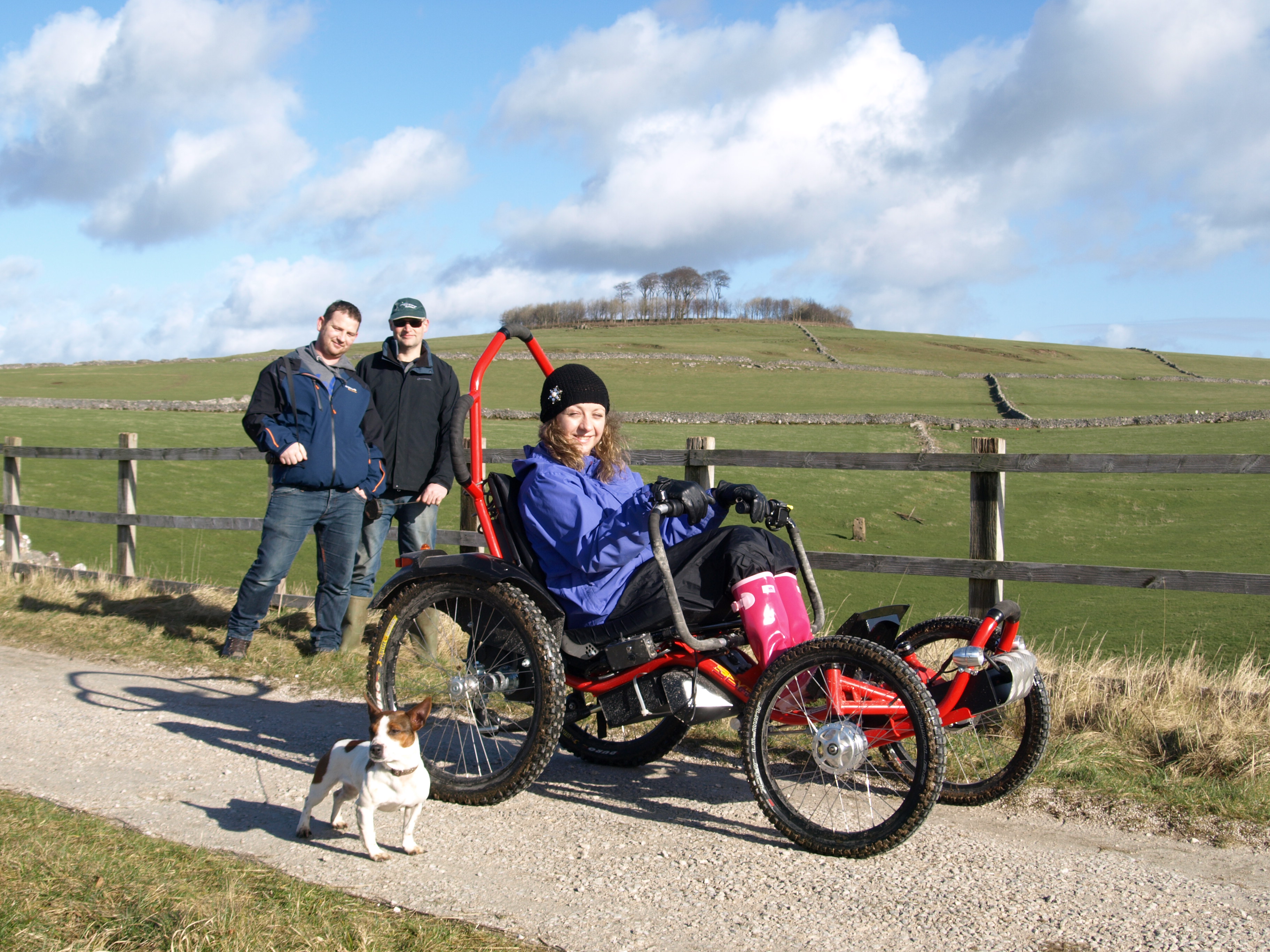A guest using an accessible four-wheel bike at Hoe Grange Holidays, Derbyshire