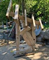 Large wooden sculpture of child at Ellesmere Sculpture Trail