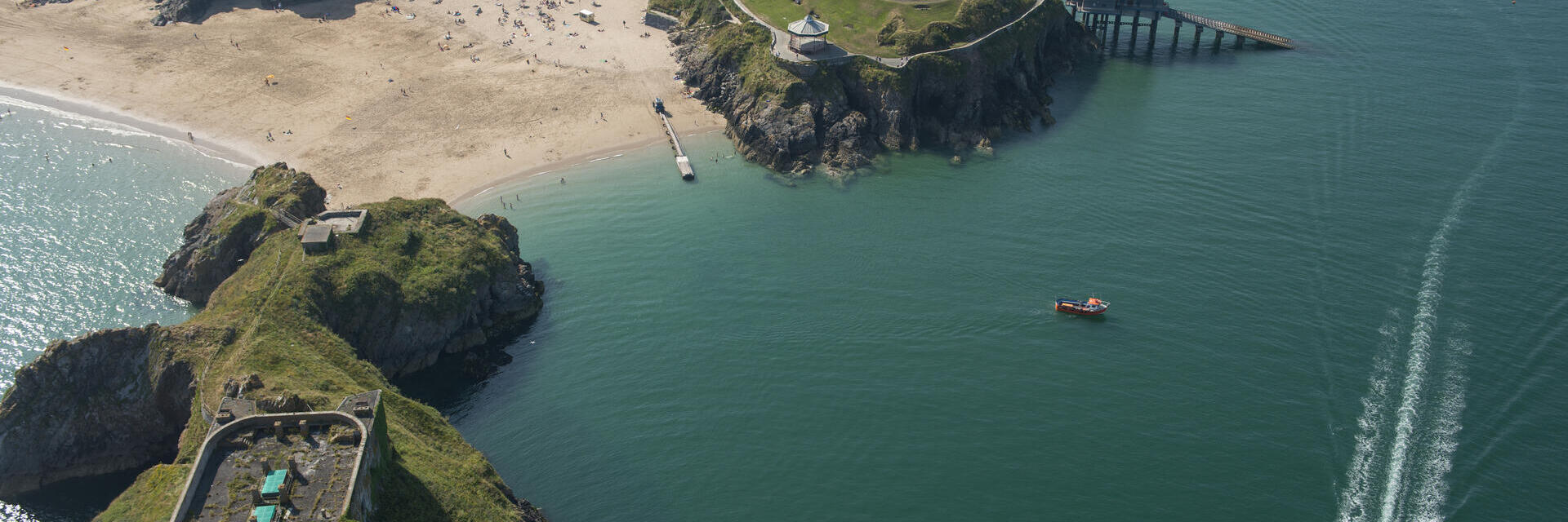 Coastline of a town with beach and castle