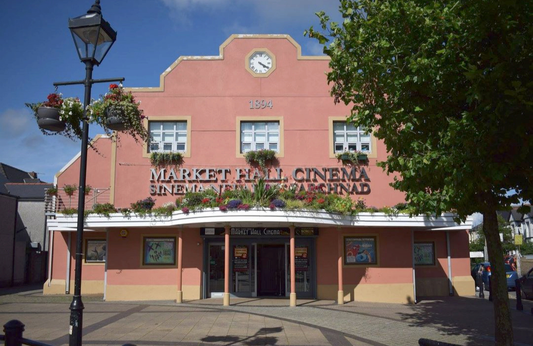 Exterior of building with sign reading: Market Hall Cinema