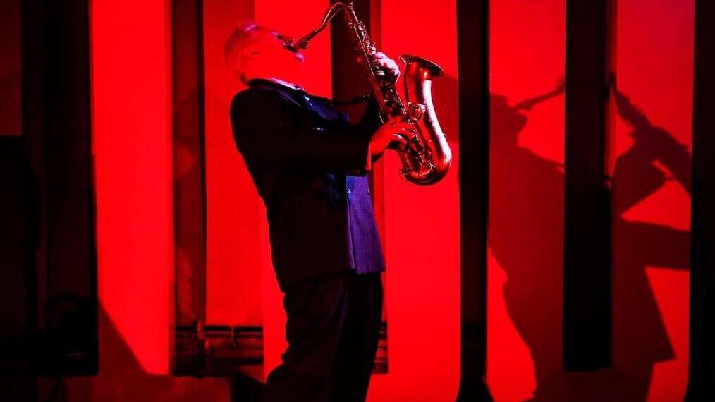 A jazz performer on stage at the 100 Club, an intimate and historic venue in the heart of London's Soho district