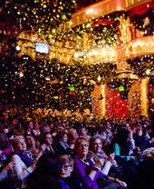An audience watching a performance in Manchester's Palace Theatre
