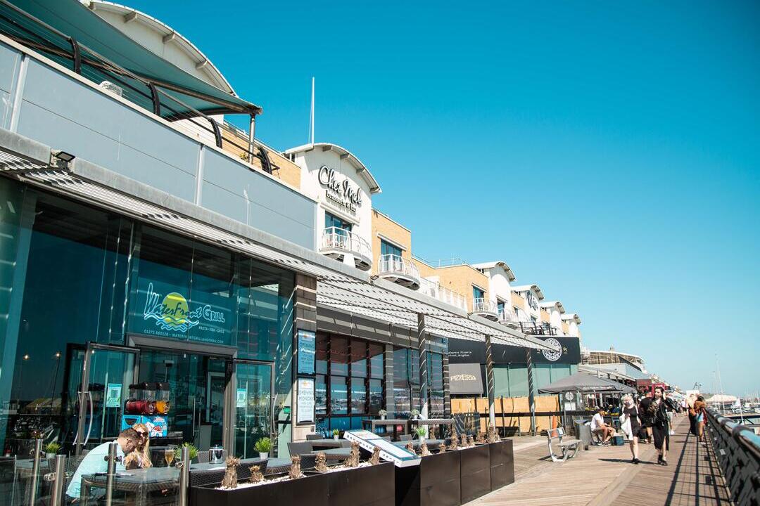 A row of shops and restaurants on Brighton's Marina