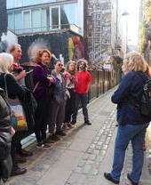 Group of people on street taking part in Belfast Music Tours