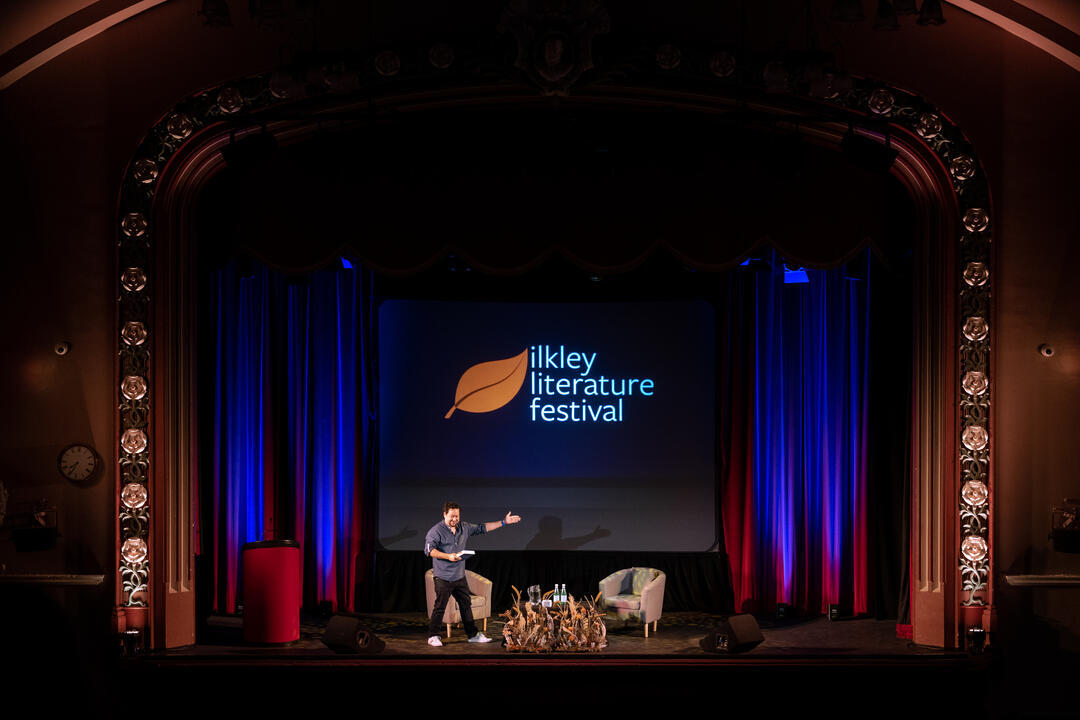 Presenter on stage at the Ilkey Literature Festival