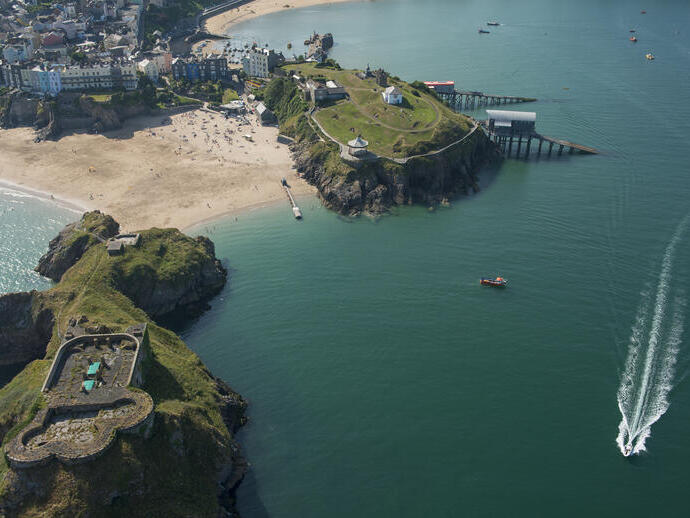 Coastline of a town with beach and castle