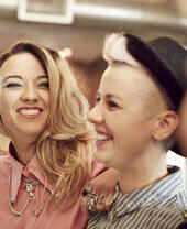 Smiling lesbian couple in a bar