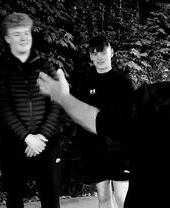 A group of people on a guided ghost walk around the town of Tenby in Wales