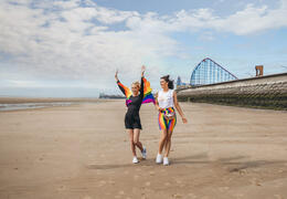 Two women having fun on Blackpool beach