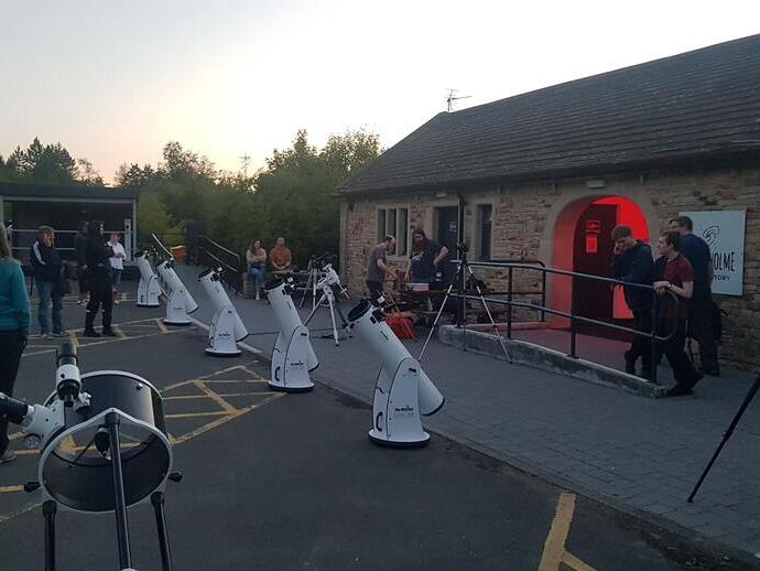 Rows of telescopes being prepared for an evening of stargazing at Grassholme Observatory, Durham