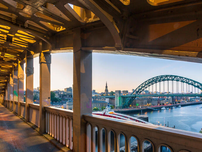 View from pedestrian level of the two bridges connecting Newcastle and Gateshead during a summer evening in June.