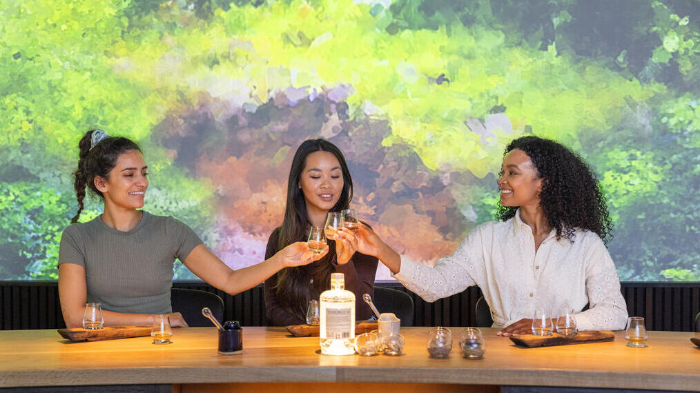 Three women having a tasting session at a whisky distillery