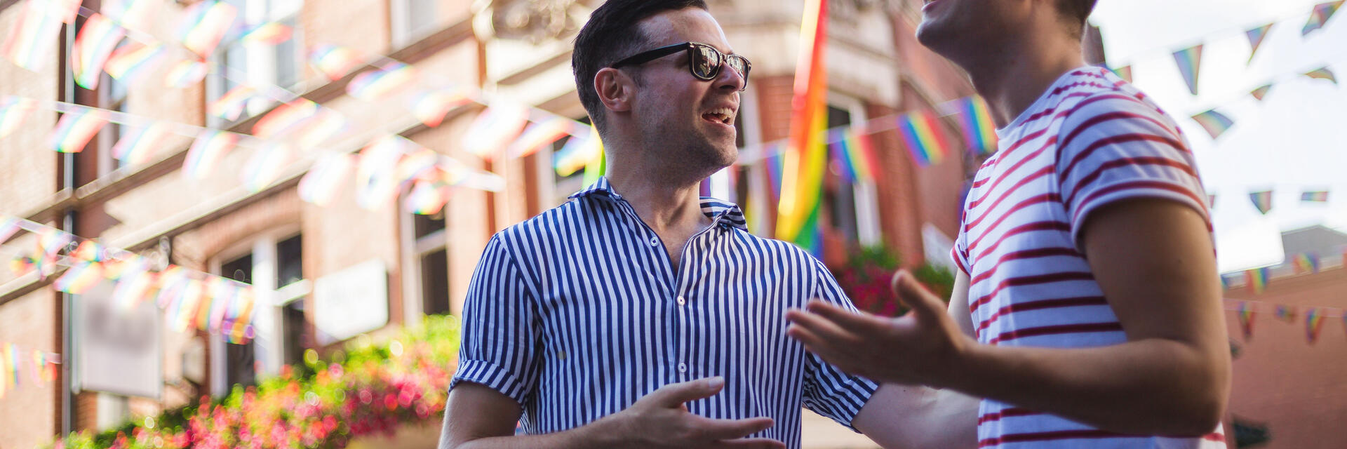 Young men talk outside a bar