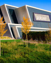 Exterior shot of a live events venue with a modern architectural style.