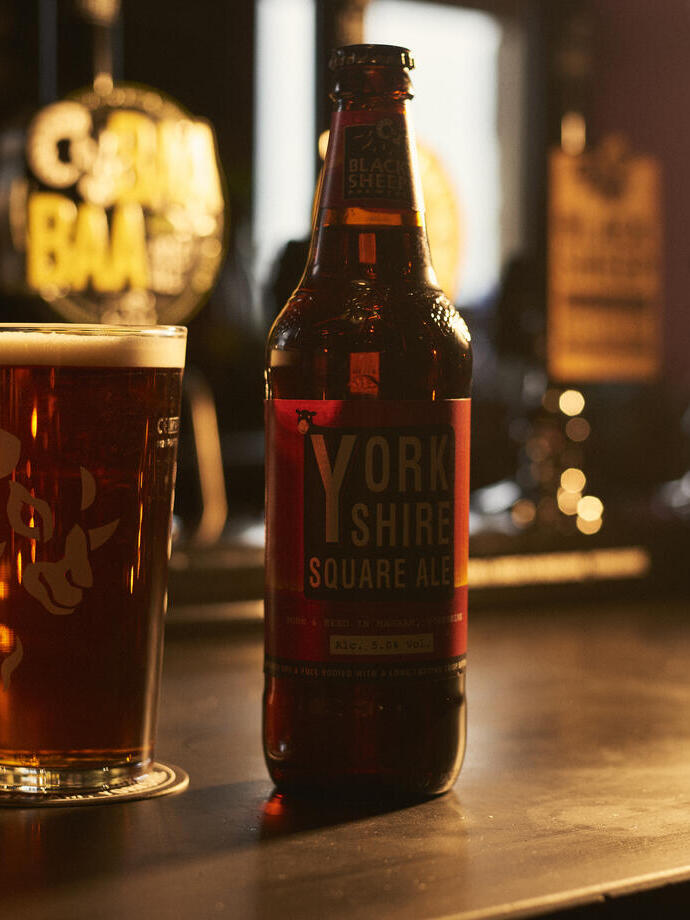 Close up of selection of beers on wooden shelf
