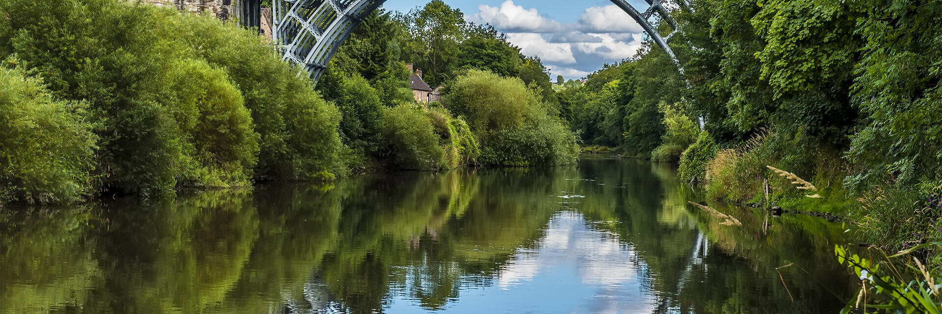 A lovely iron arched bridge over a pretty river