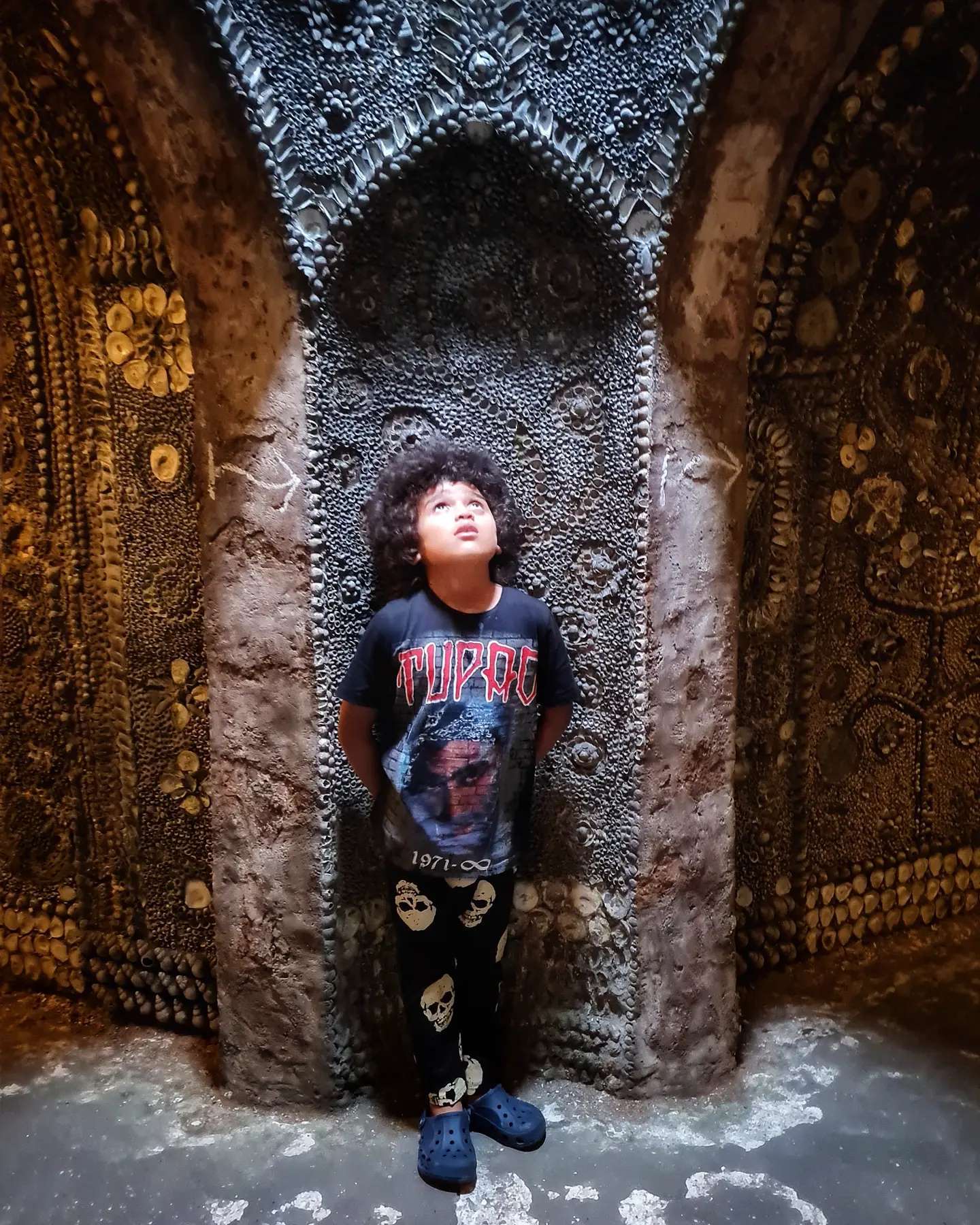 A boy in Shell Grotto