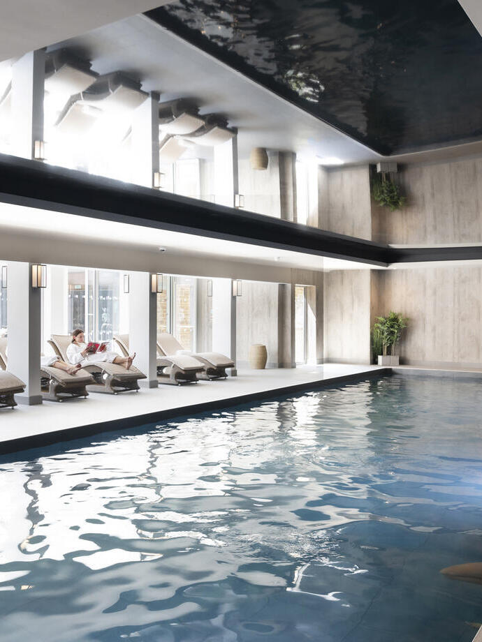 A woman relaxing inside a spa area.