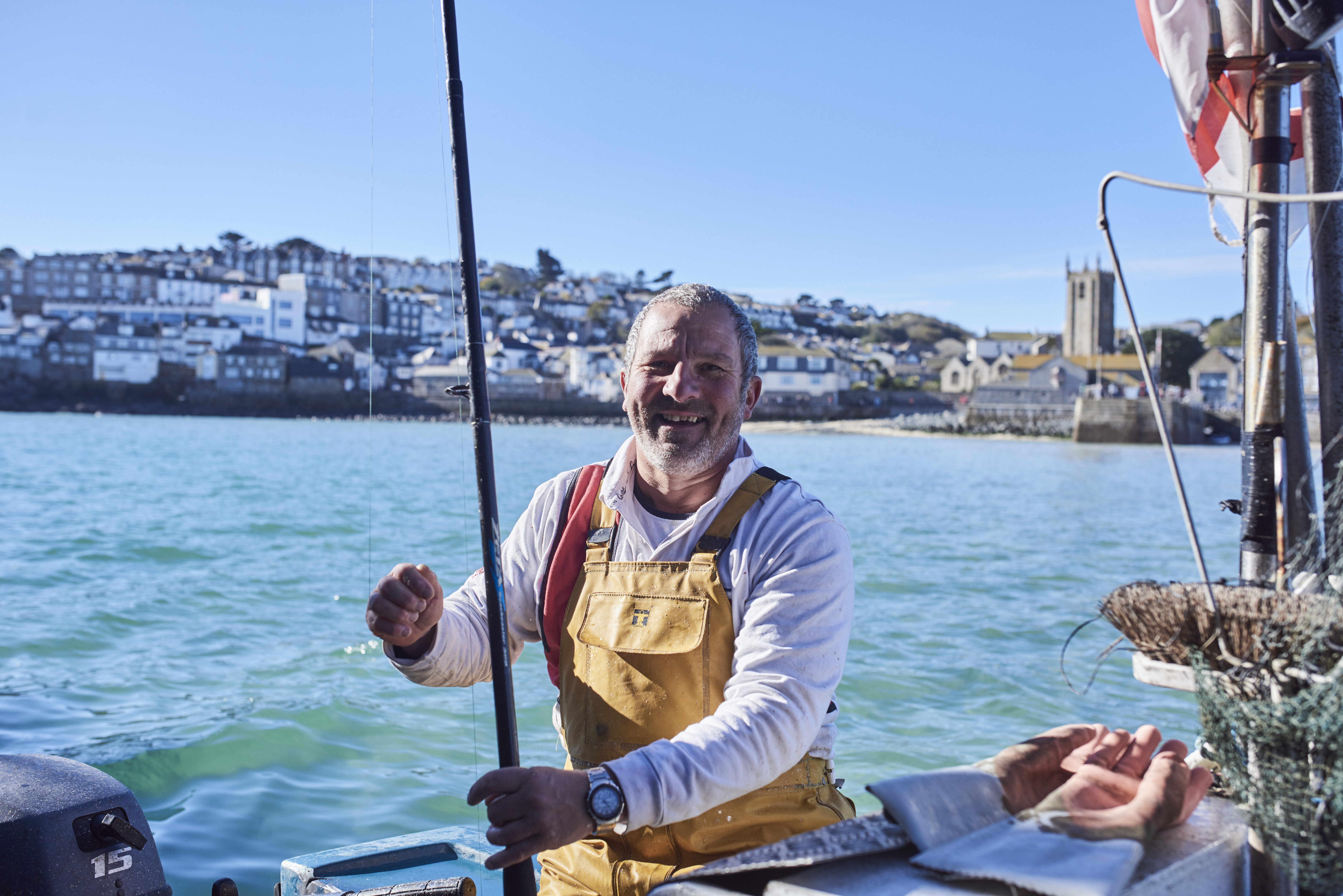 Fisherman in a fishing boat in the sea