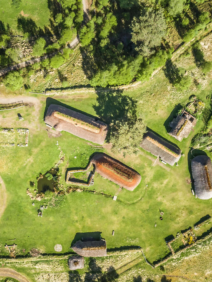 Overhead view of historic huts compound in the countryside