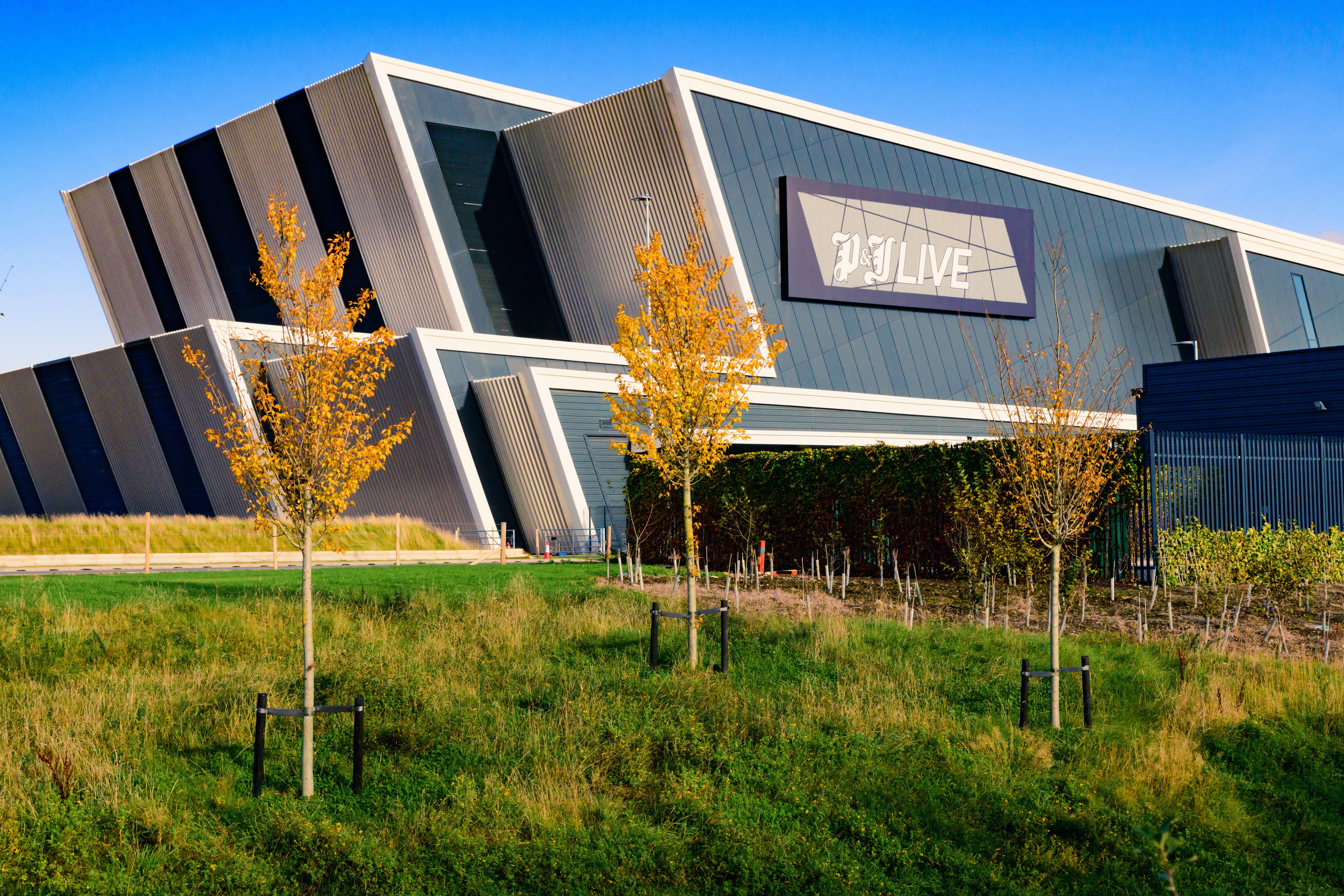 Exterior shot of a live events venue with a modern architectural style.
