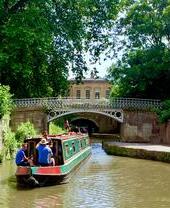 A barge sailing down a canal in Bath