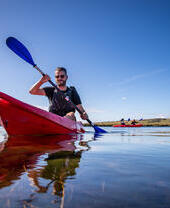 Man kayaking on a sunny day