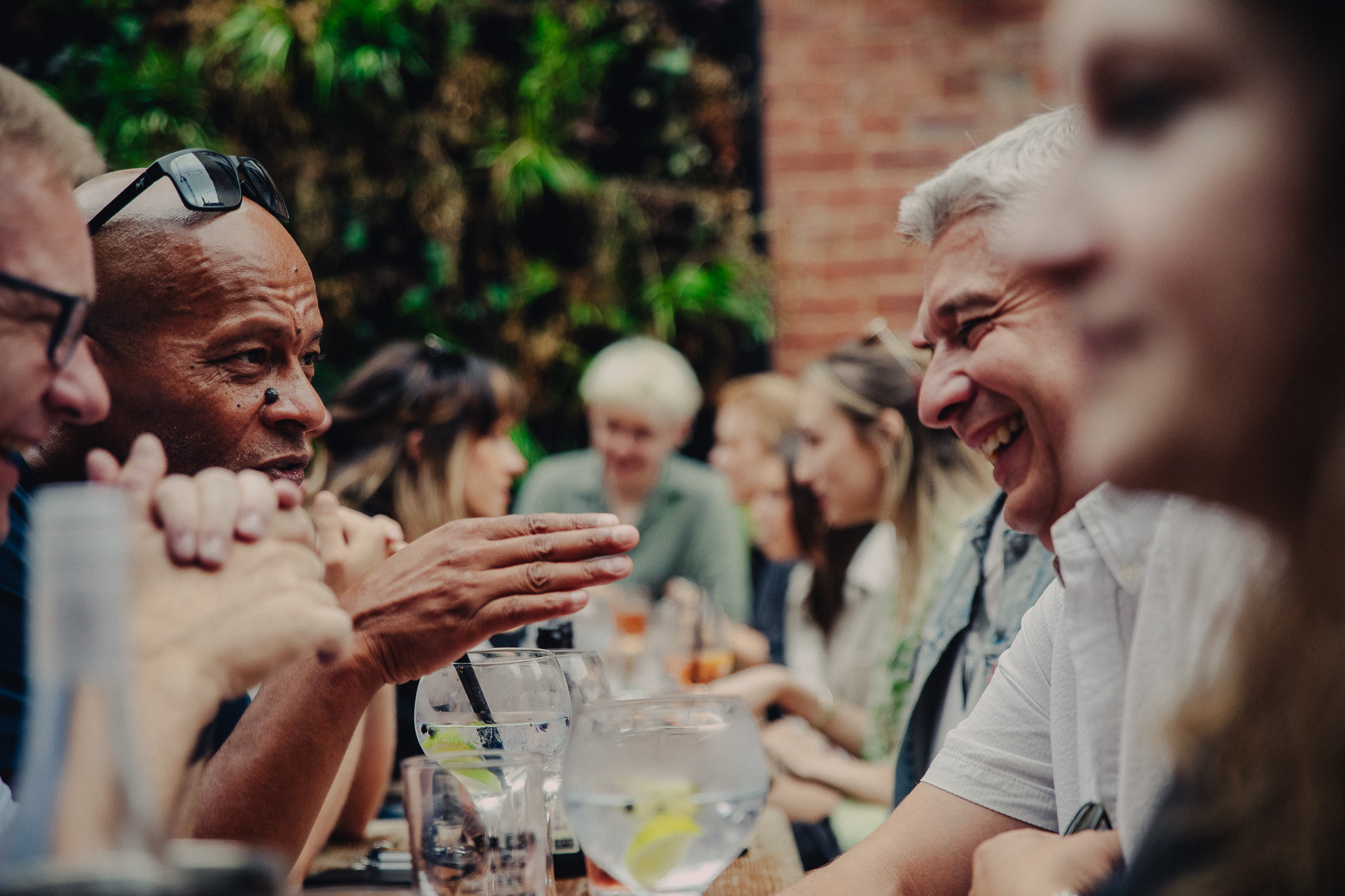 Groups of people sitting outside and drinking