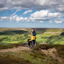 Man and woman at Bank Top, Rosedale, man using a wheelchair.