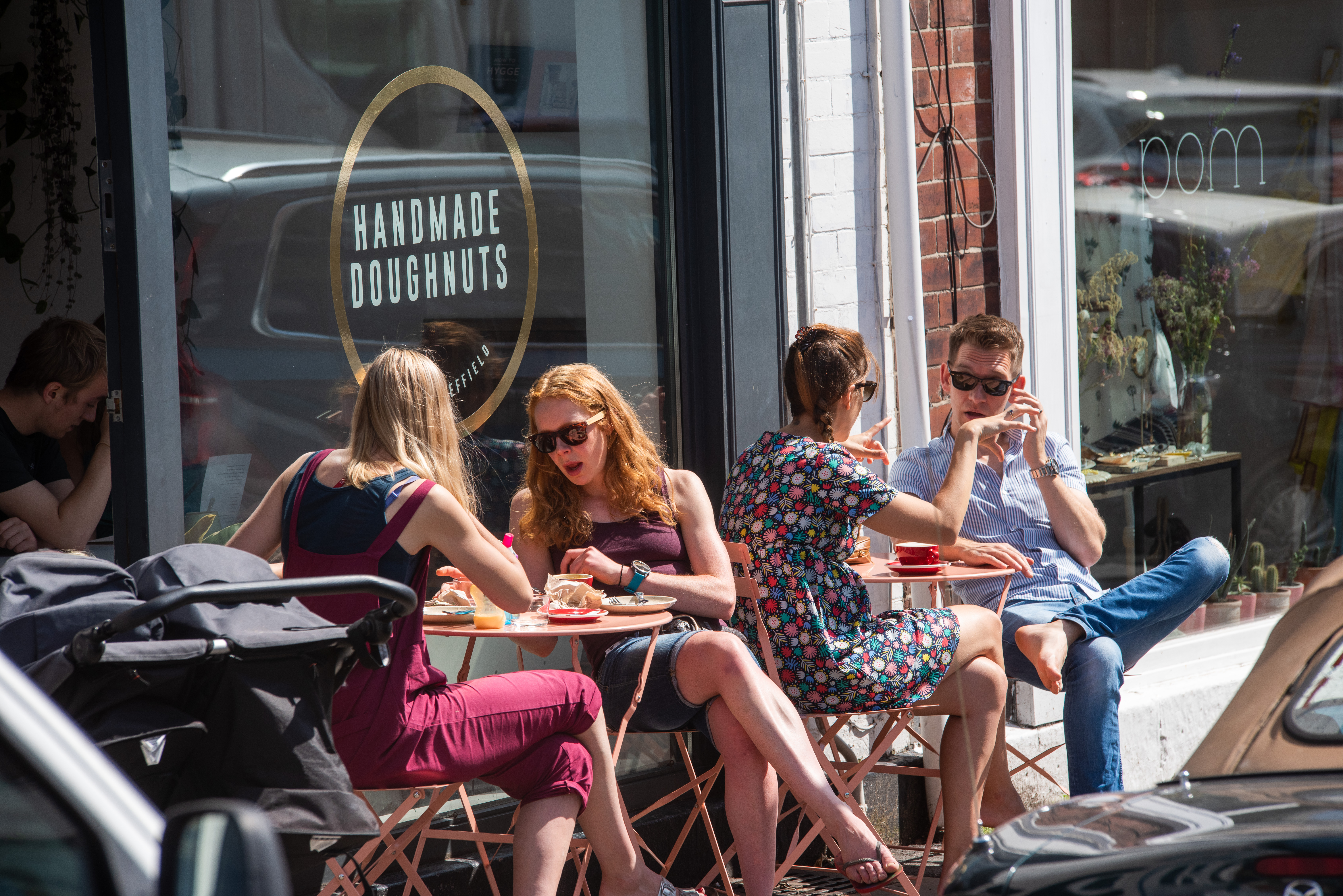 Groups of people sitting outside Handmade Doughnuts in Sheffield