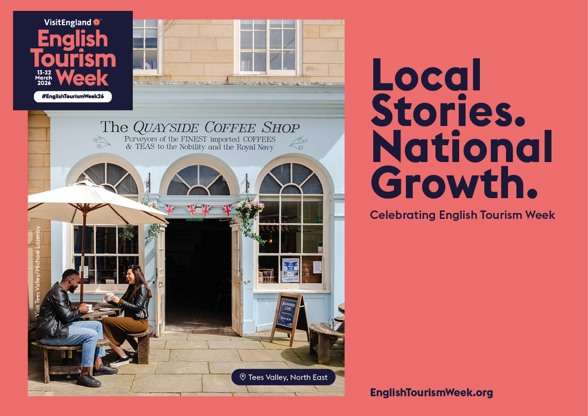 Outdoor scene of two people at a café, The Quayside Coffee Shop, in Tees Valley promoting English Tourism Week with banners and campaign slogan.